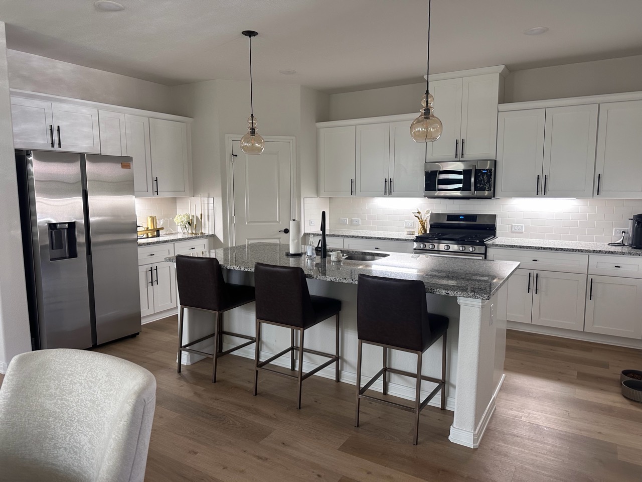 Airbnb kitchen with island and stainless steel appliances