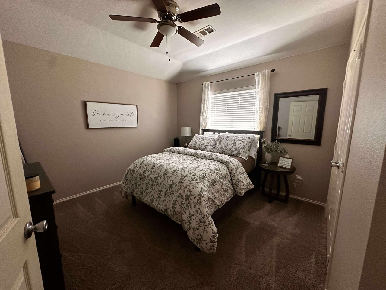 Guest bedroom with floral bedding