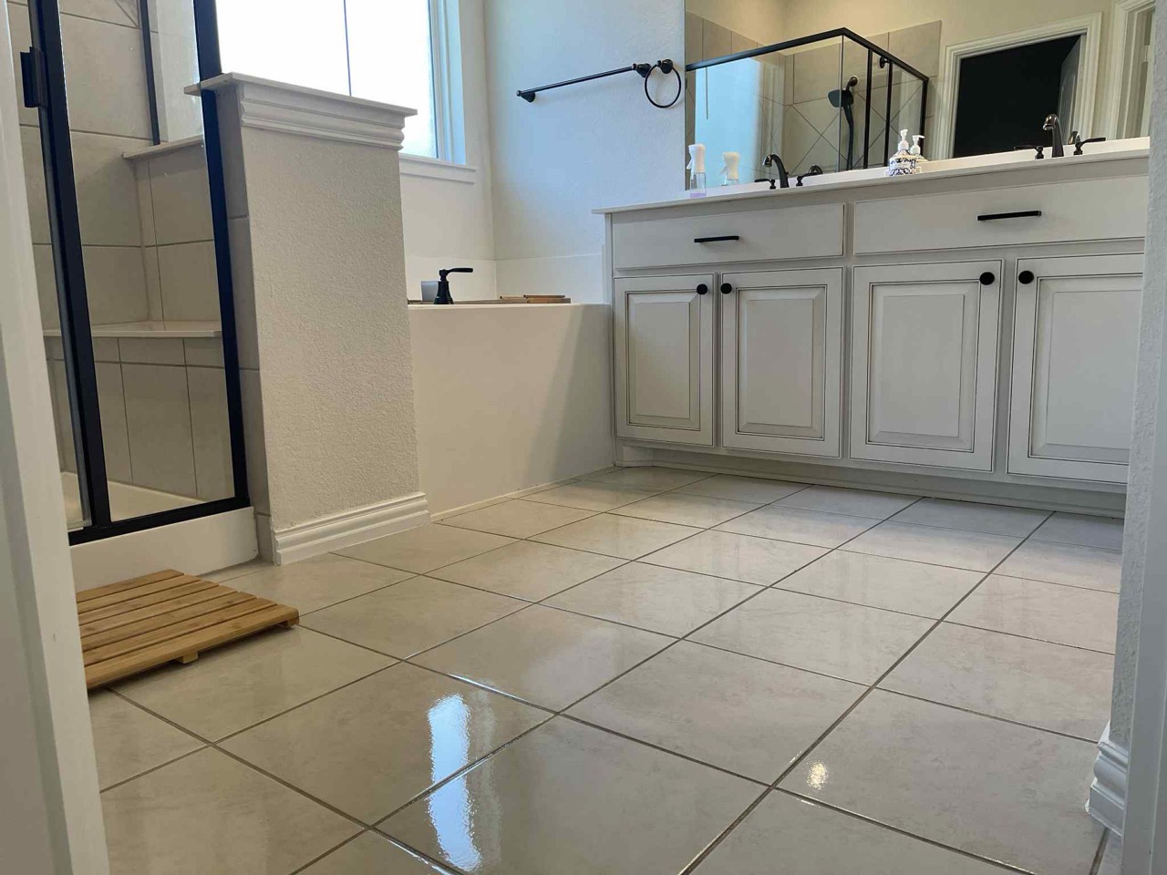 Bathroom vanity, shower and tile flooring